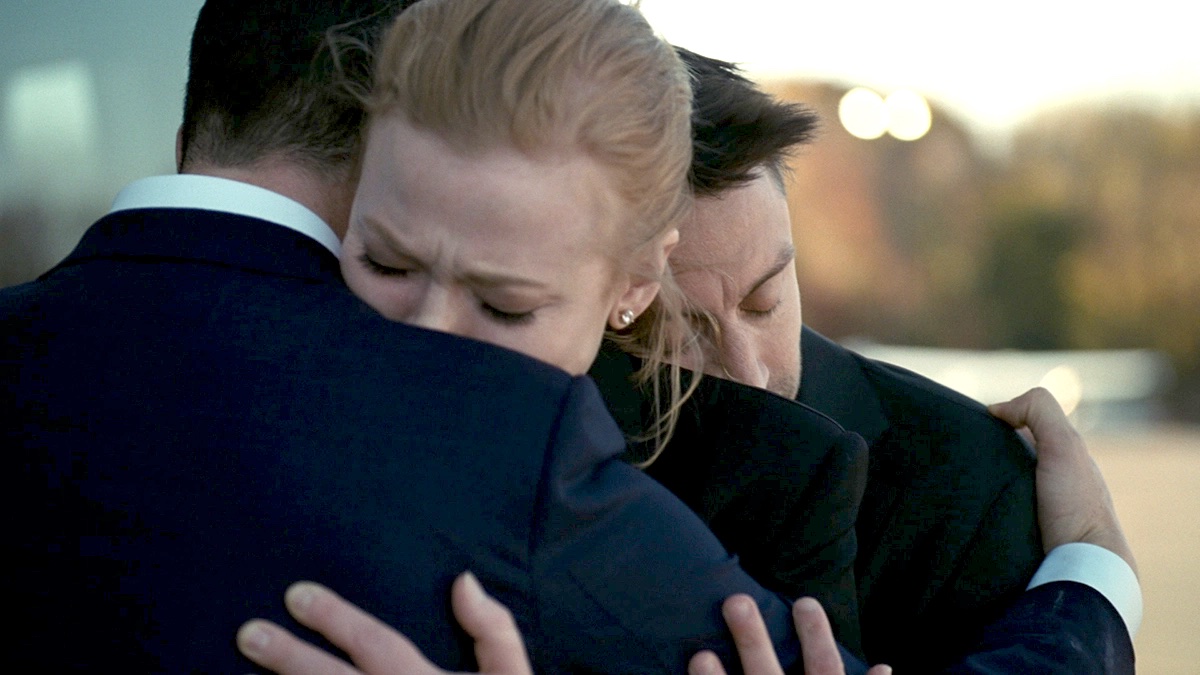 Jeremy Strong, Sarah SNook, and Kieran Culkin hugging as Kendall, Shiv, and Roman on Succession