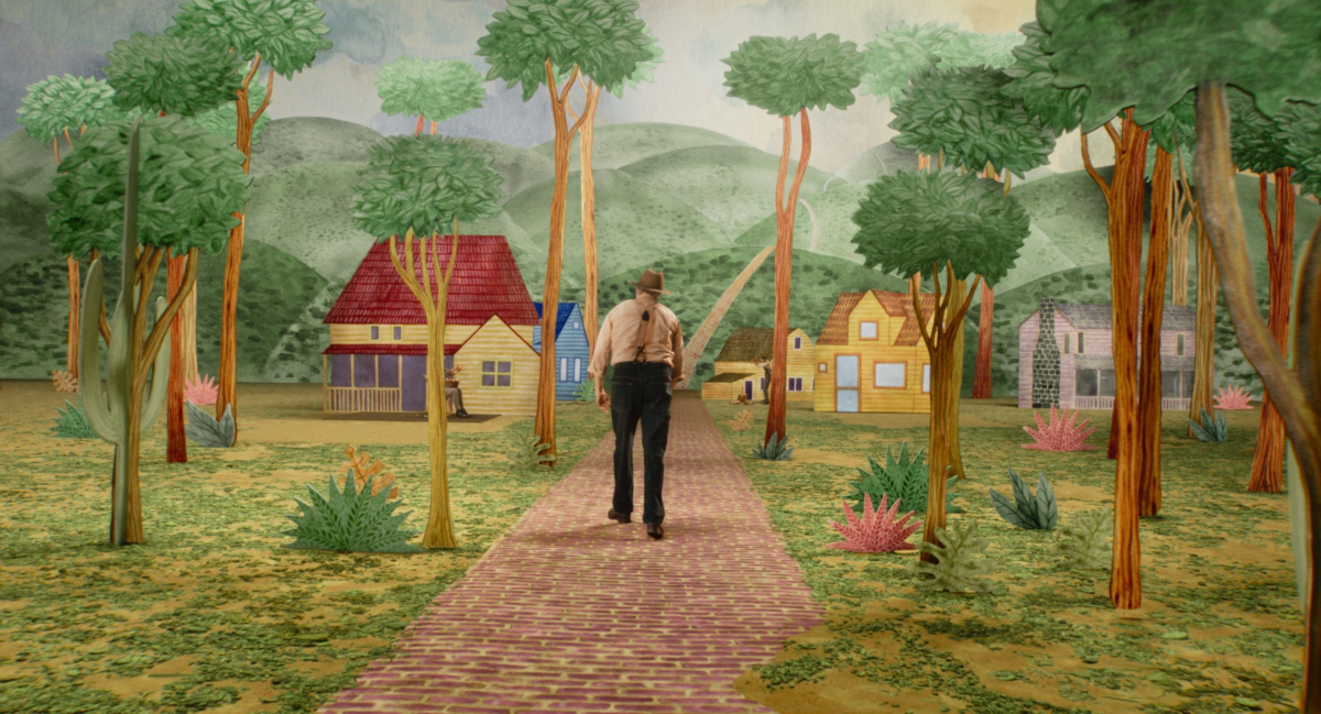 Joaquin Phoenix walks through an artificial landscape in 'Beau Is Afraid'