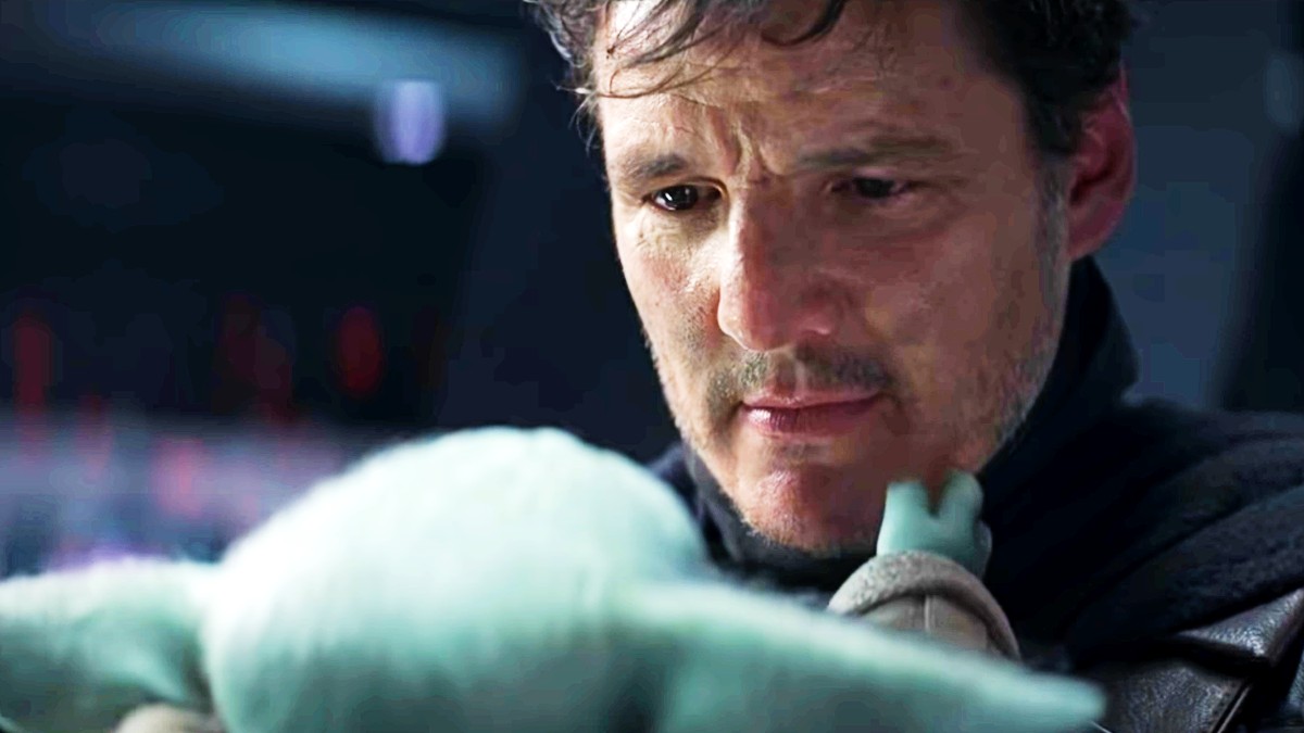 Pedro Pascal as Din Djarin saying bye to Grogu in The Mandalorian