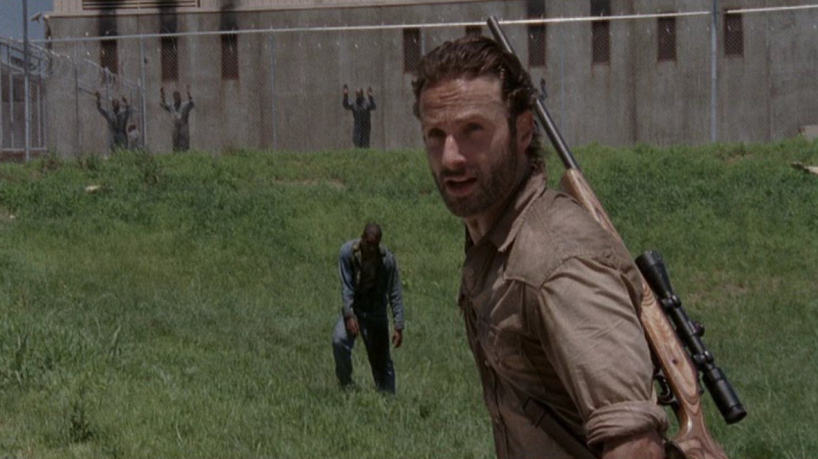 Rick outside of the prison gates in The Walking Dead season 3