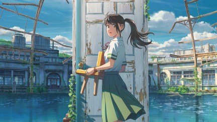 Suzume standing in front of a door