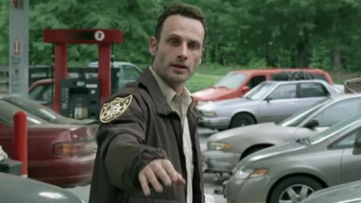 Rick Grimes stands in his police officer uniform