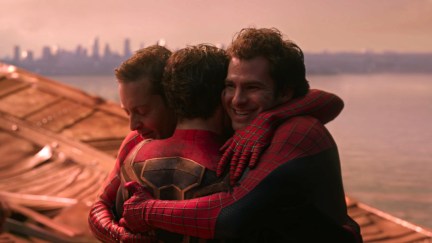All three versions of Spider-Man (Tobey Maguire, Andrew Garfield, and Tom Holland) hugging each other at the end of 'Spider-Man: No Way Home'