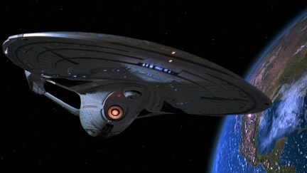 The USS Enterprise NCC-1701-E hovers near Earth