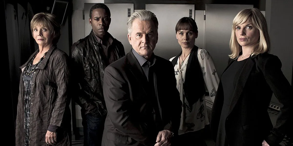 From left to right: Sue Johnston as Dr. Grace Foley, Wil Johnson as DI Spencer Jordan, Trevor Eve as DSU Peter Boyd, Tara Fitzgerald as Dr. Eve Lockhart in Waking the Dead