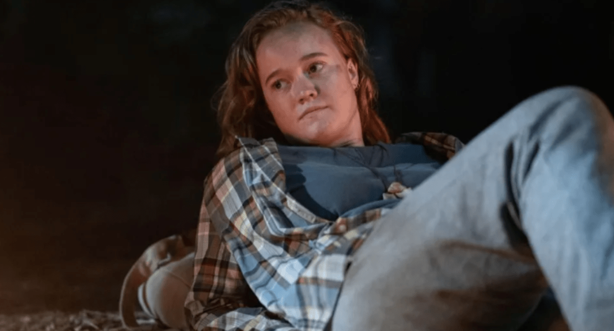 Liv Hewson lays on the ground as Van in the show 'Yellowjackets'