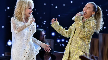 Dolly parton and Miley Cyrus perform on stage.
