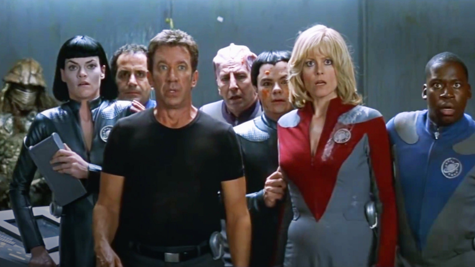 The cast of Galaxy Quest standing in an elevator