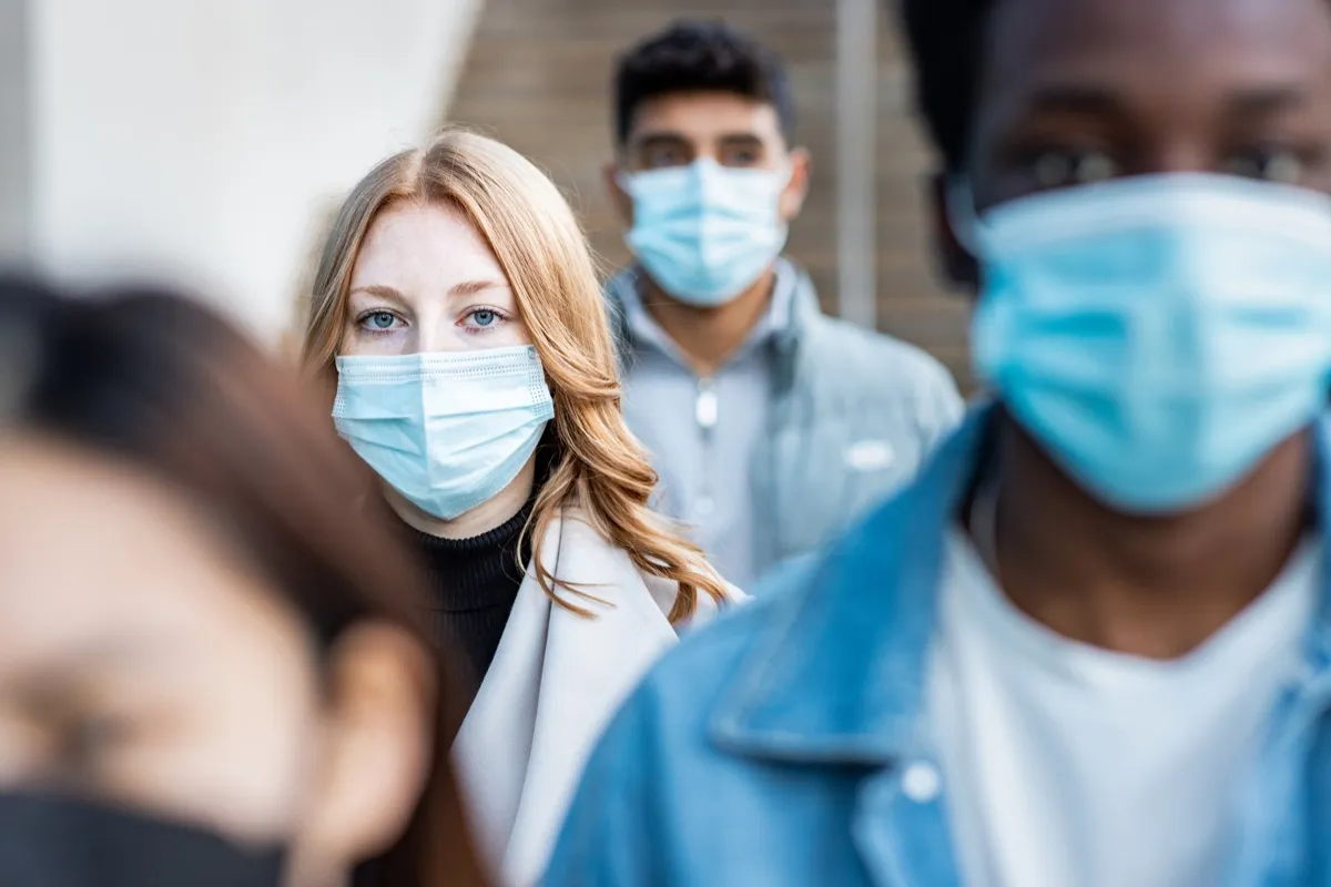 People wearing surgical face masks.
