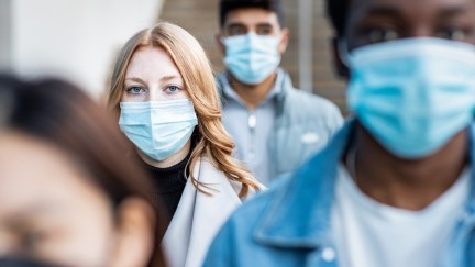 People wearing surgical face masks.