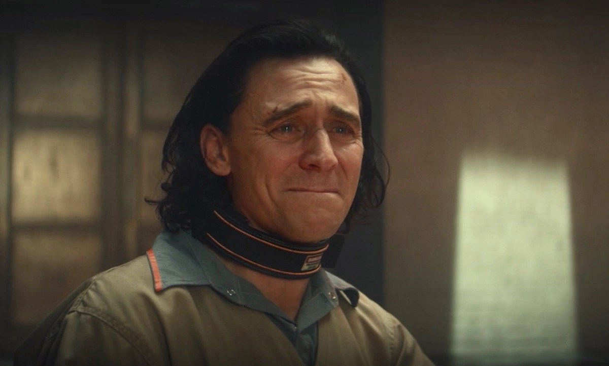 Loki holds back tears, wearing his TVA prisoner jumpsuit.