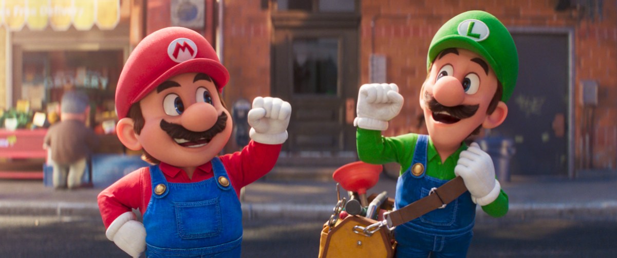 Mario and Luigi pump their fists, standing in the street. Luigi has a bag of plumbing tools on his shoulder.