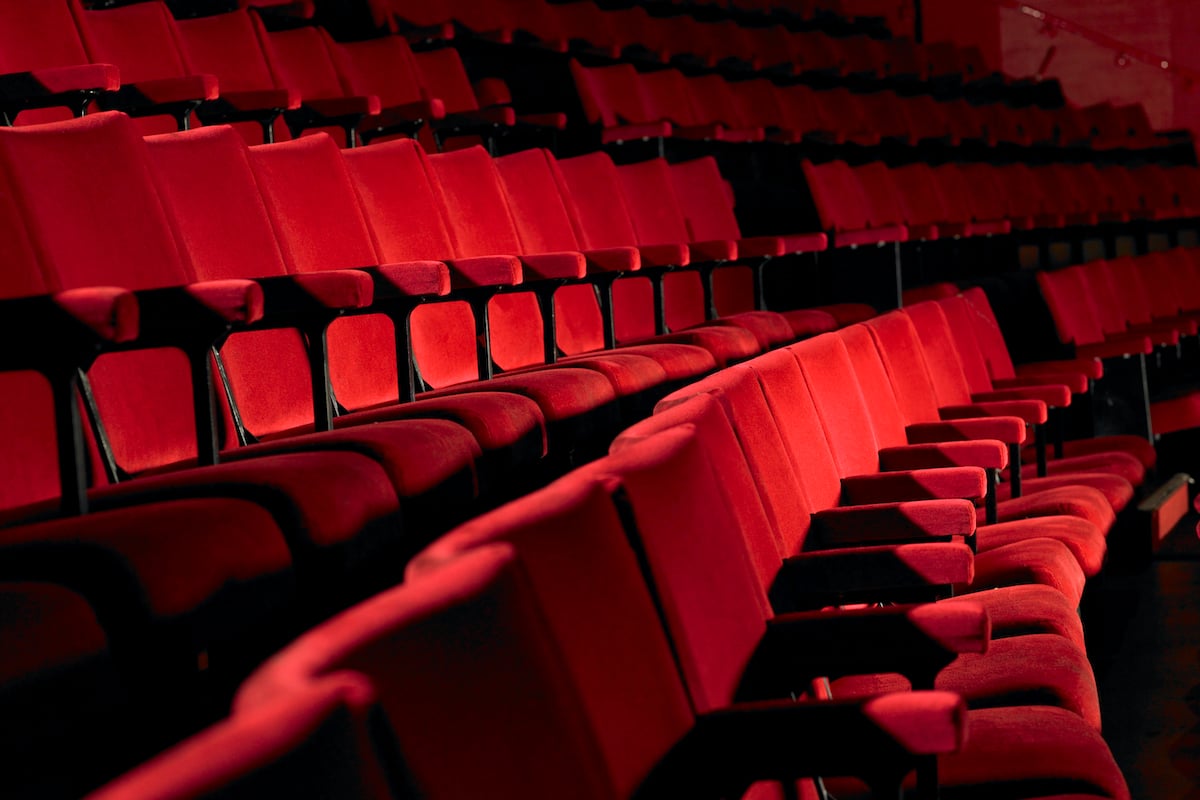 Rows of empty red theater seats