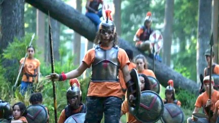 Teens dressed in armor in the woods in Percy Jackson Disney+ series trailer.