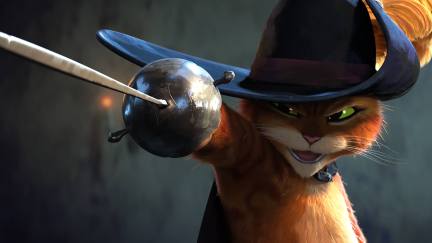A still from Puss in Boots: The Last Wish of orange cat Puss in Boots wearing his trademark hat with a feather in it and sticking out his sword.