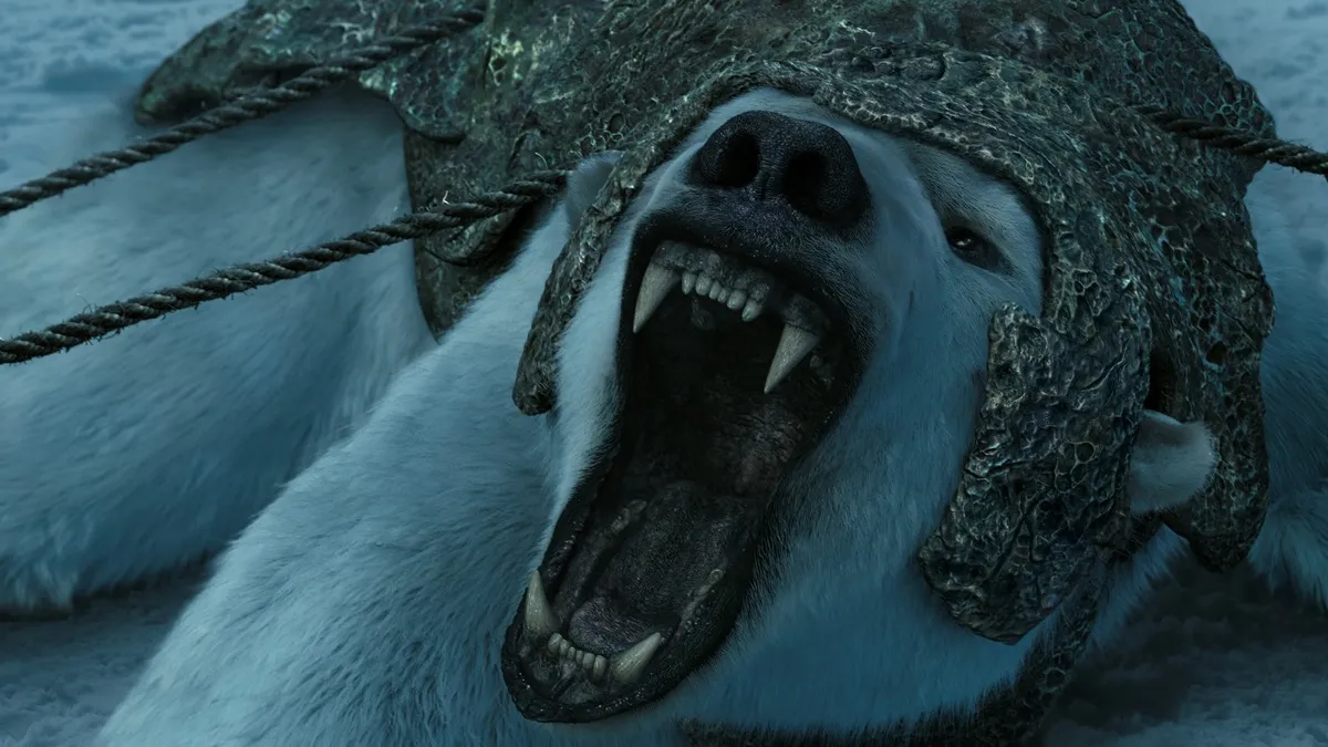 A polar bear in armor roars while being held down by ropes in "The Golden Compass"