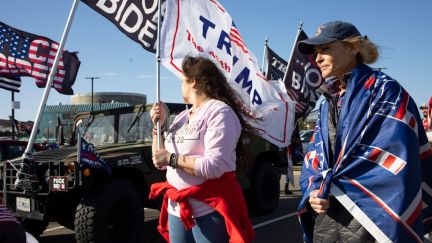 Pro-Trump protesters carry flags