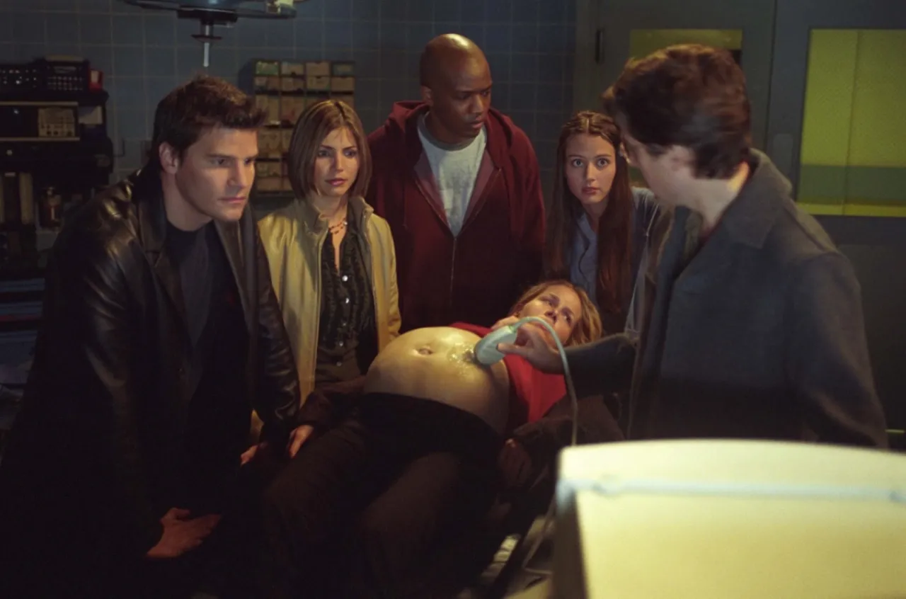 Angel and the crew looking at his and Darla's baby through an ultrasound in Angel season 3
