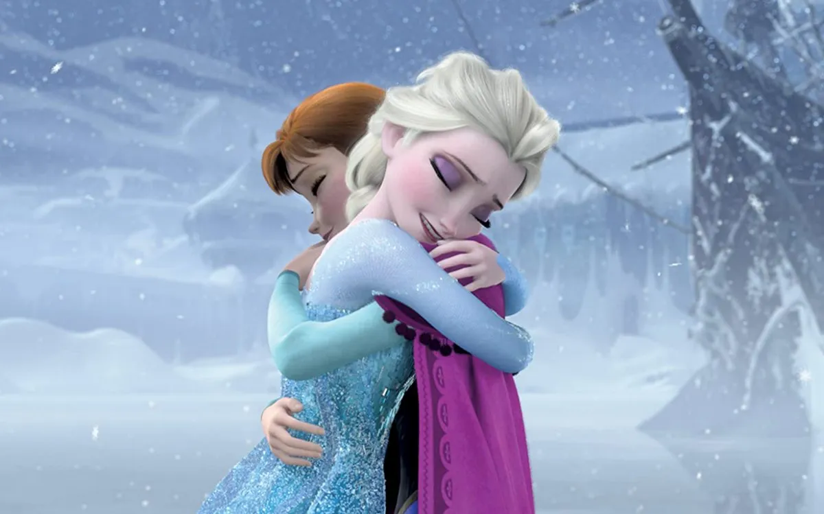 Elsa and Anna hugging in Frozen (Disney)
