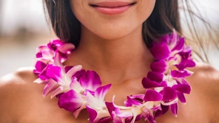 Hawaiian woman wearing a lei.