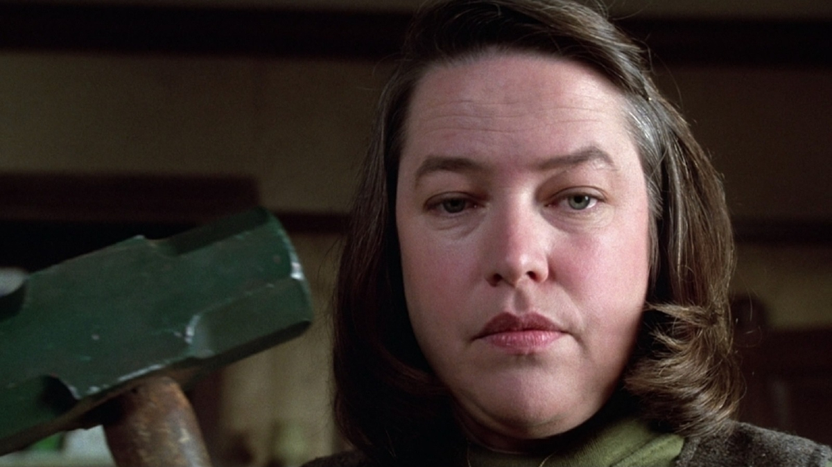 Kathy Bates holding a sledgehammer in 'Misery'.