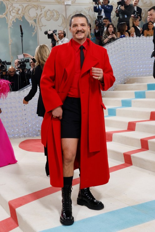 Pedro Pascal wears a red coat and black little lad shorts