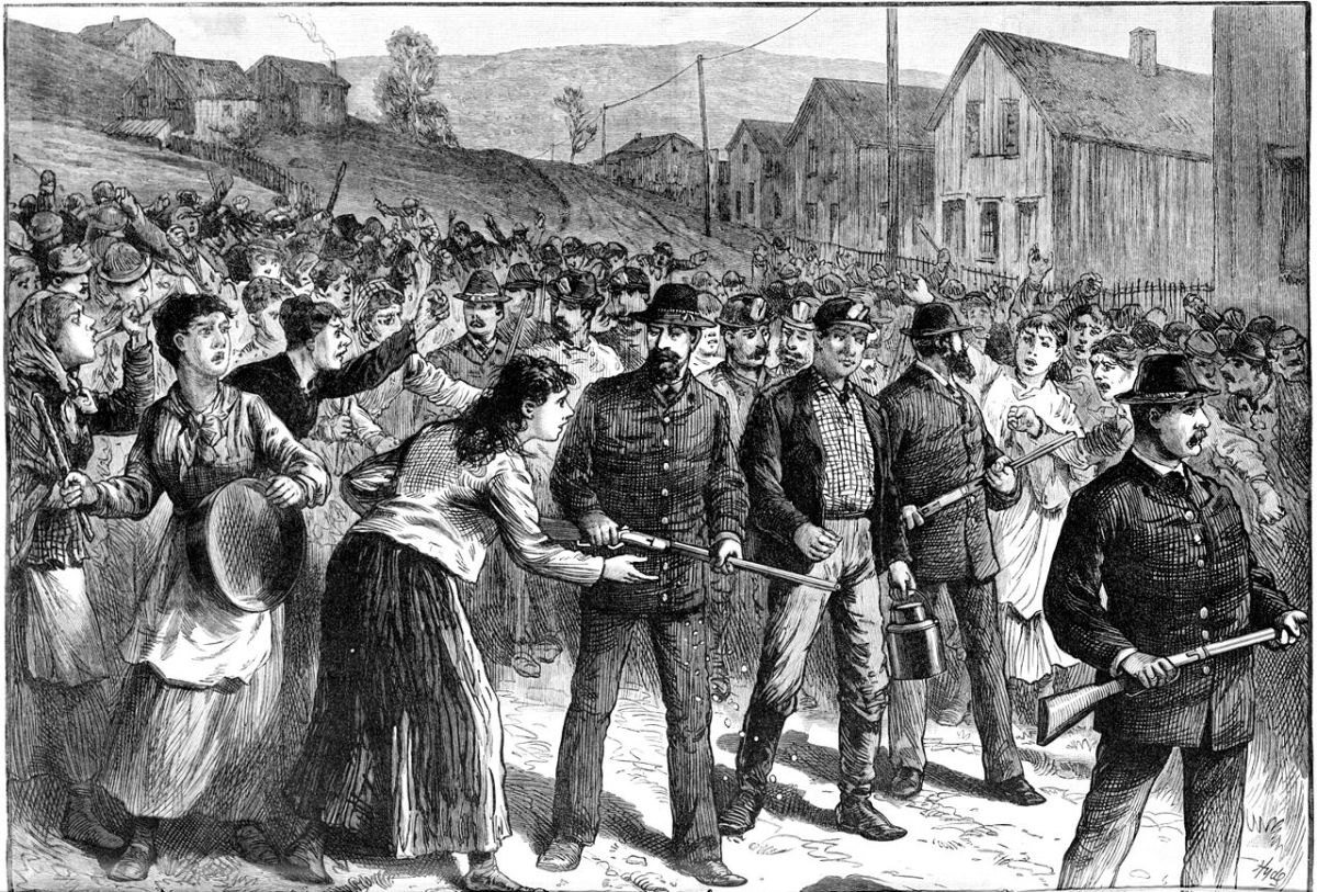 Pinkerton guards escorting scabs during a 1884 miners strike in Buchtel Ohio.