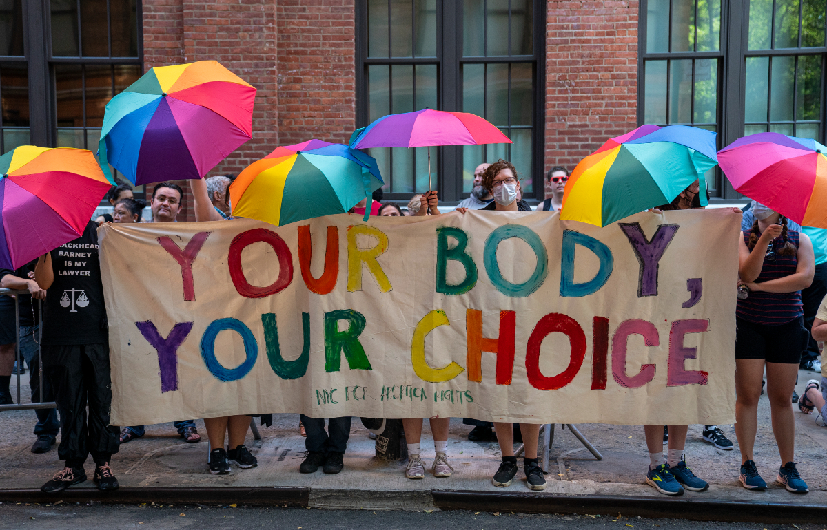 Pro-choice protesters hold up a sign that reads "Your body, your choice" in New York City