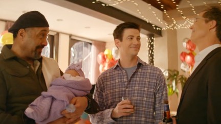 Joe West holding baby Nora West-Allen, Barry Allen, and Harrison Wells in The Flash series finale