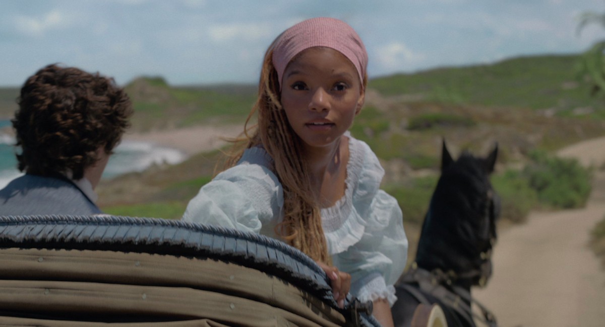 Halle Bailey as Ariel rides in a carriage