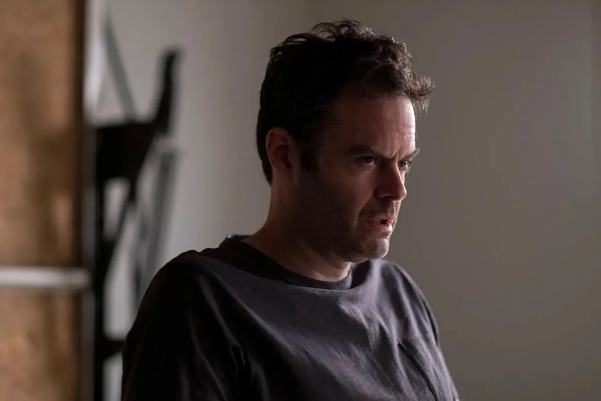 Barry (Bill Hader) sits in a garage, frowning.