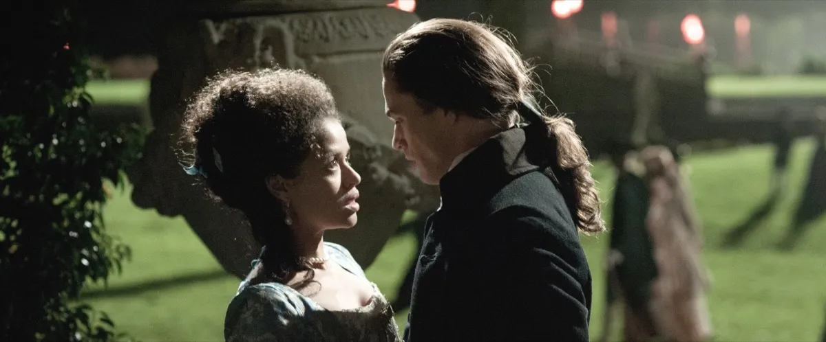 Two aristocratic English lovers gaze into each other's eyes in "Belle"