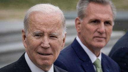 Joe Biden and Kevin McCarthy both give semi-smirks.