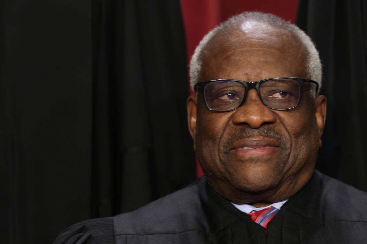 U.S. Supreme Court Justice Clarence Thomas, posing for his official portrait, looking somewhat uneasily off to the side.