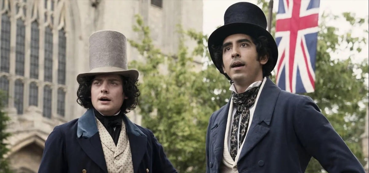 Two English gentleman gaze curiously while standing on the street in "The Personal history of David Copperfield"