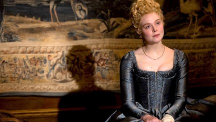 Elle Fanning as Catherine the Great in Hulu's The Great. She sits pensively.