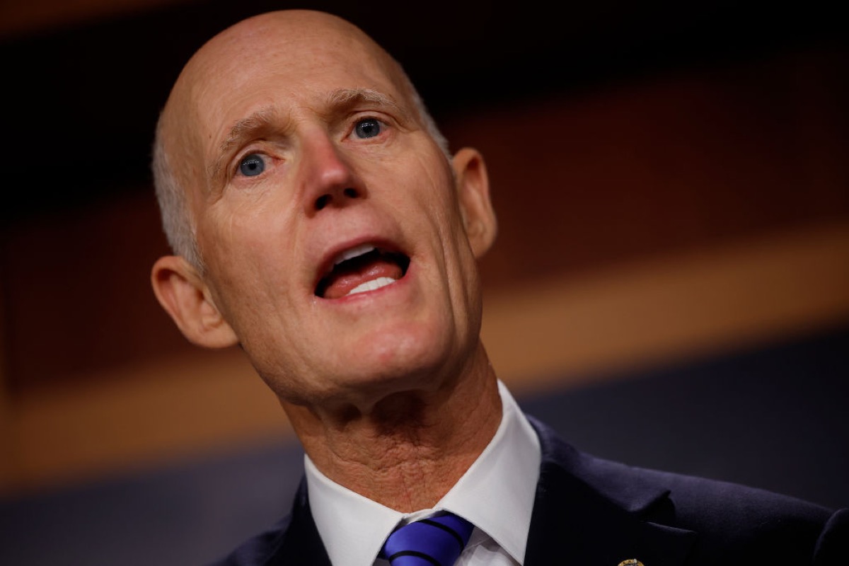 Florida Senator Rick Scott with his big, ignorant mouth wide open, spewing hate.