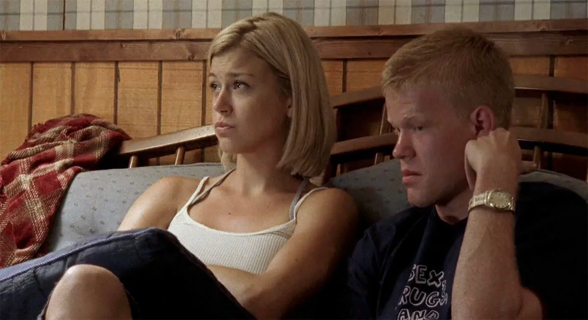 Landry and Tyra together on a couch in Friday Night Lights