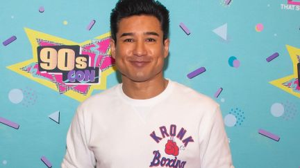 Mario Lopez smirks at the camera on the red carpet for 