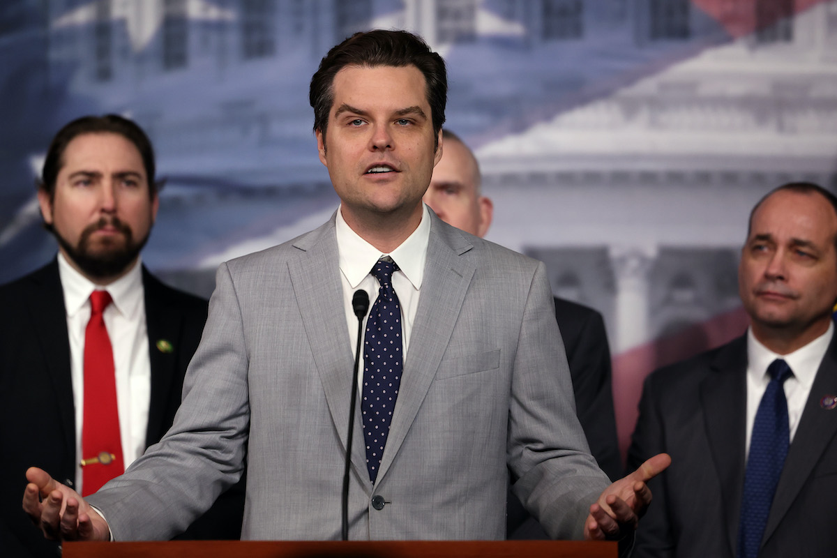 Matt Gaetz speaks from a podium and gestures broadly.