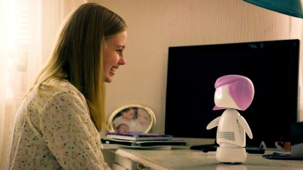 Angourie Rice as Rachel Groggins in Black Mirror with a robot