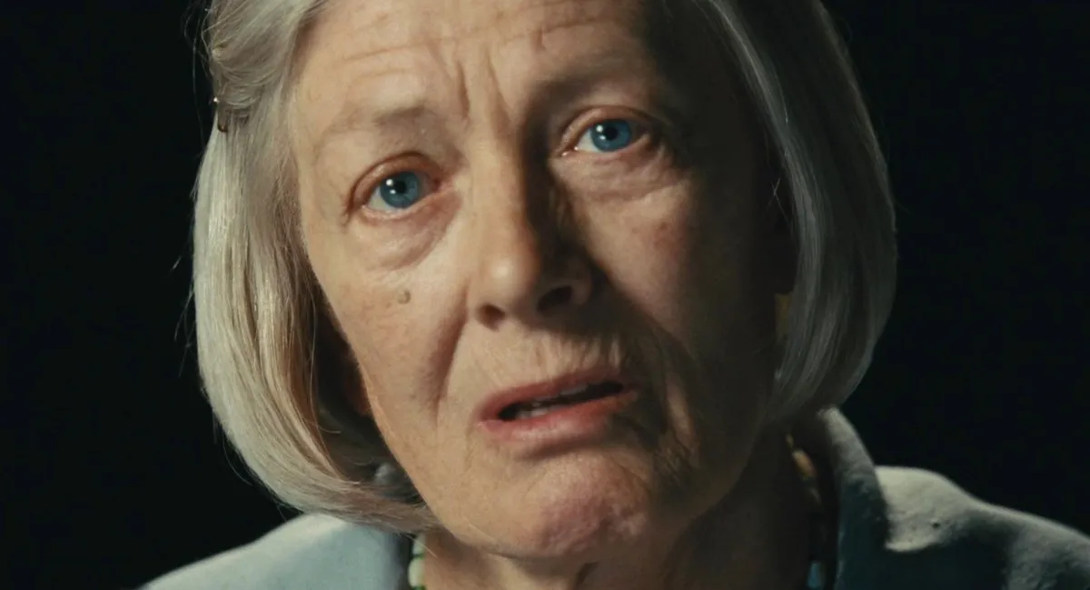 An elderly white woman with a bob haircut stares nervously into the camera in "Atonement"