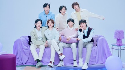 A photo of the seven members of BTS in a purple studio released for the 2023 BTS Festa