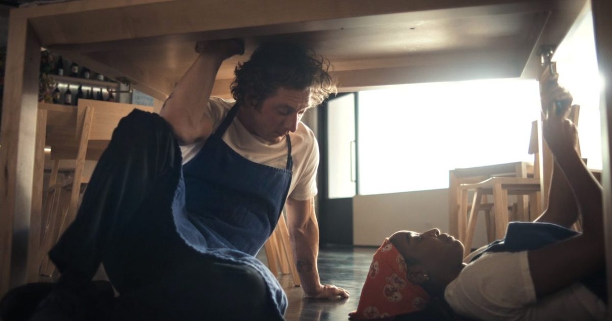 Carmy (Jeremy Allen White) and Sydney (Ayo Edebiri) eating together in The Bear. (FX)