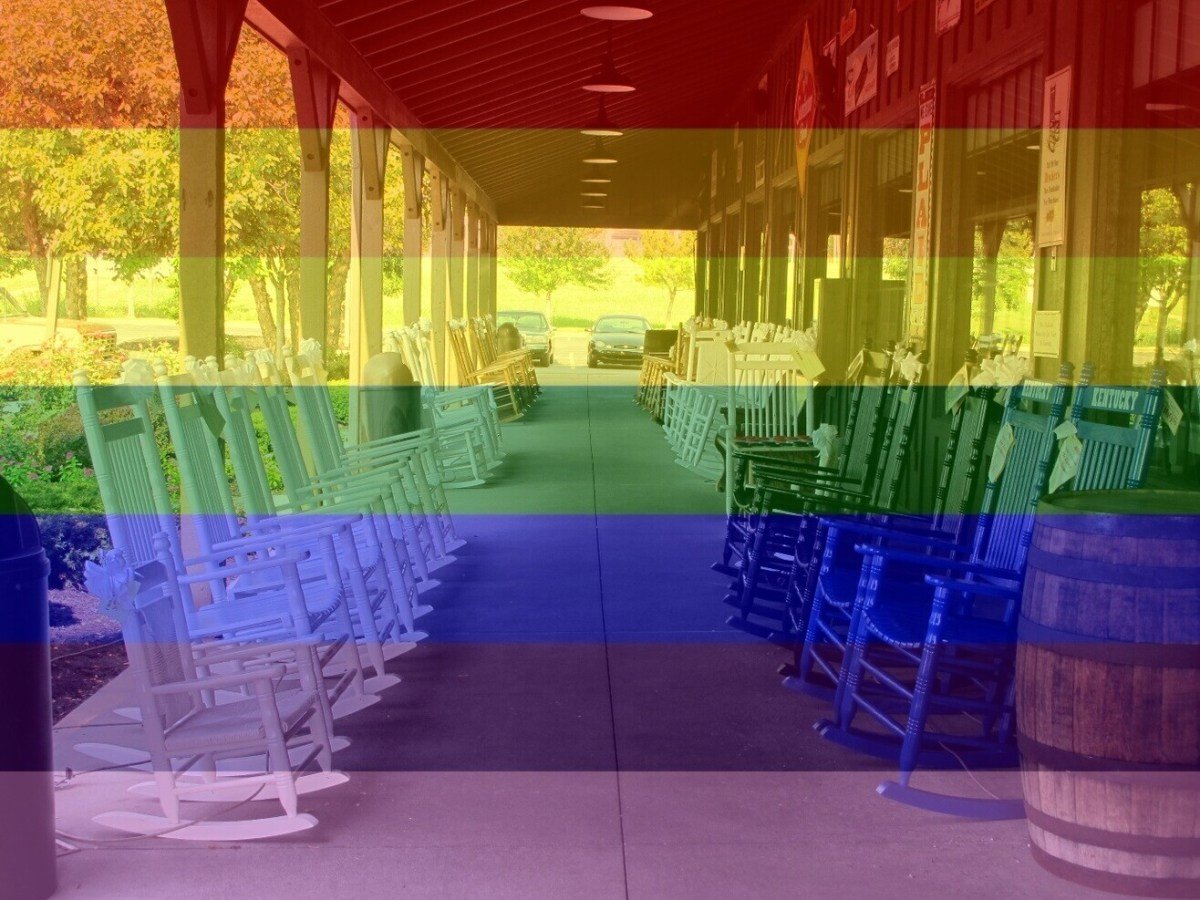 Rocking chairs in front of a Cracker Barrel restaurant with a rainbow filter
