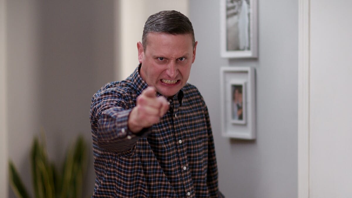 Tim Robinson pointing at the camera angrily in the "Darmine Doggy Door" sketch from 'I Think You Should Leave' season 3