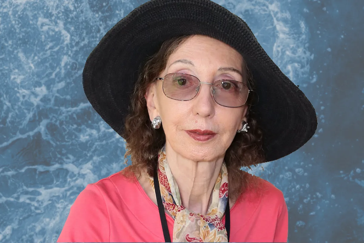 A photo of Joyce Carol Oates superimposed over a background of ocean waves