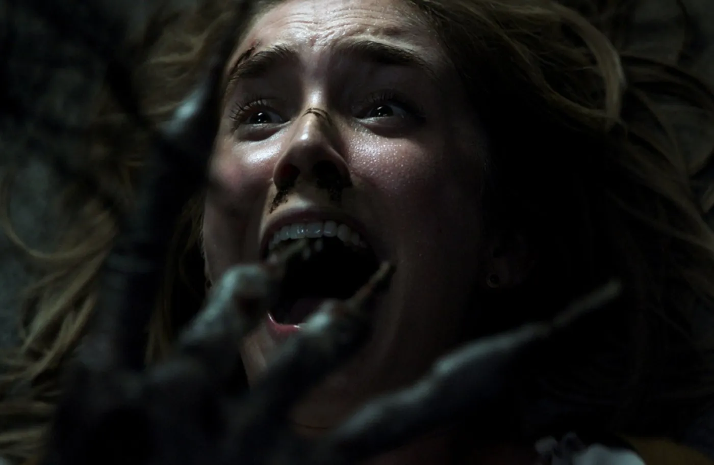 Melissa Rainier being attacked by "Key Face" in Insidious: The Last Key