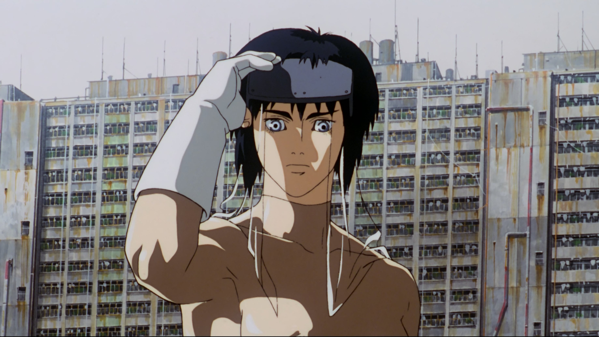 An animated person looks into the distance wearing a white glove, a dilapidated building behind them