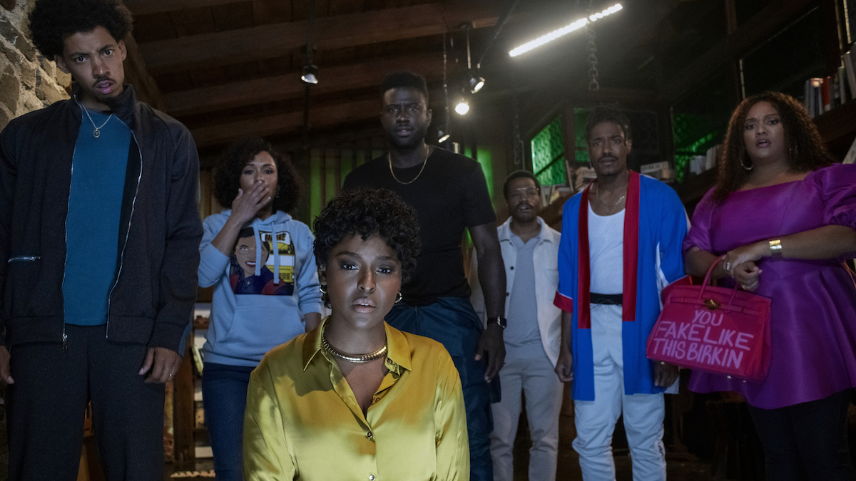 The cast of The Blackening stare into the camera, each looking afraid.